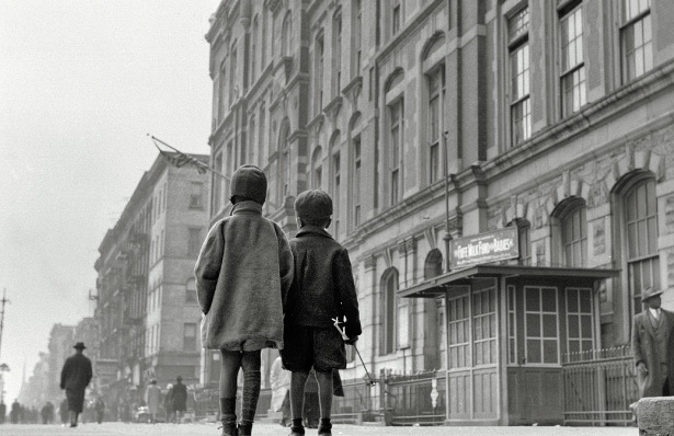 Two children absorb the images and sounds of Harlem in 1943