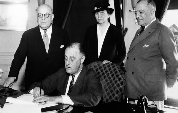 Franklin Roosevelt signs the National Labor Relations Act of 1935.