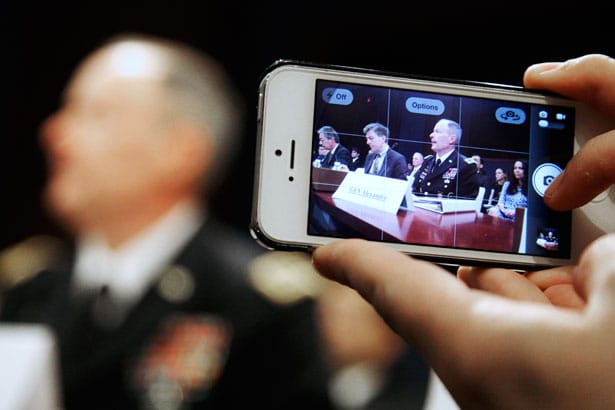 A-reporter-takes-a-mobile-phone-picture-of-National-Security-Agency-NSA-Director-Reuters