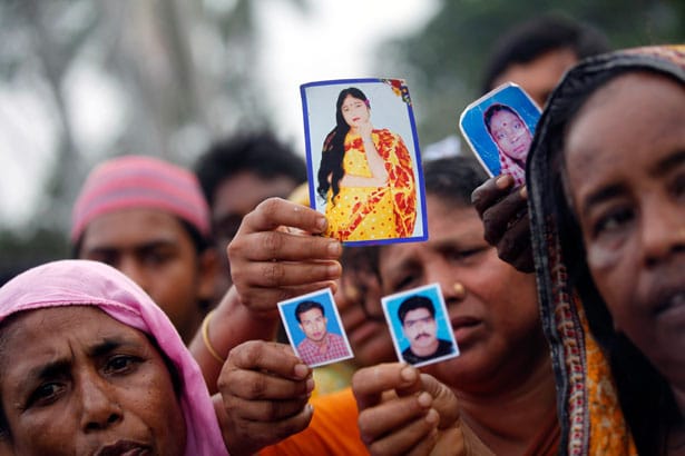 pemRelatives-show-pictures-of-garment-workers-who-died-or-went-missing-after-the-disaster-at-Rana-Plaza.-ReutersAndrew-Birajemp