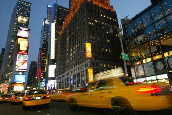 Taxicabs-speed-down-Broadway-in-New-York