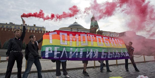 Gay-rights-activists-hold-a-banner-reading-“Homophobia—the-religion-of-bullies”-during-their-action-in-protest-of-homophobia-on-Red-Square-in-Moscow-Russia