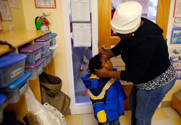 A-mother-picks-up-her-child-at-a-Head-Start-program-in-Boston