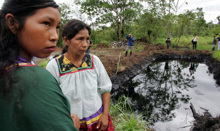 Cofán-women-near-a-pool-of-oil-in-the-Amazonian-region-of-Ecuador-2005
