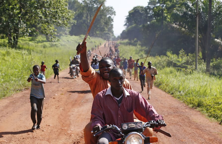 A-man-waves-a-machete-in-a-protest-against-French-peacekeeping-troops-in-the-Central-African-Republic