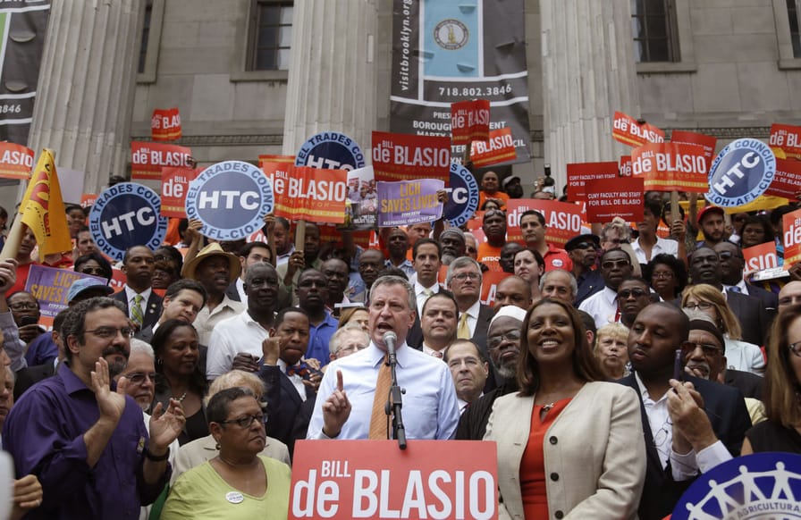 Mayor-Bill-de-Blasio-center-spoke-at-a-union-rally-in-Brooklyn-during-his-campaign.-AP-PhotoSeth-Wenig