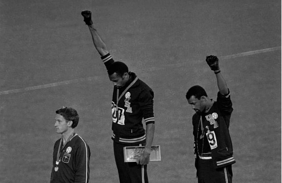 John-Carlos-Tommie-Smith-and-Peter-Norman-during-their-famous-protest-at-the-1968-Olympic-games-in-Mexico-City