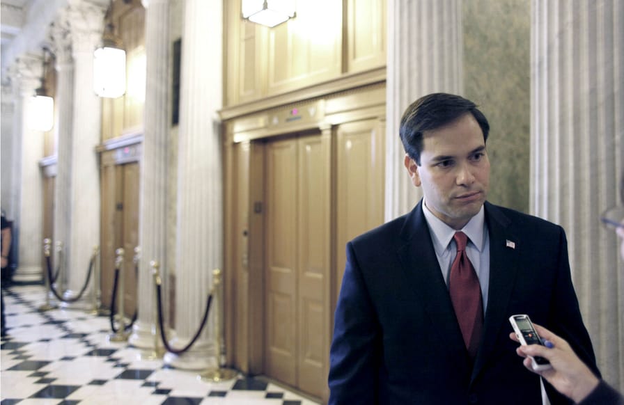 Marco-Rubio-speaks-with-a-reporter-outside-of-the-Senate-Chamber-on-Capitol-Hill.-AP-PhotoHarry-Hamburg