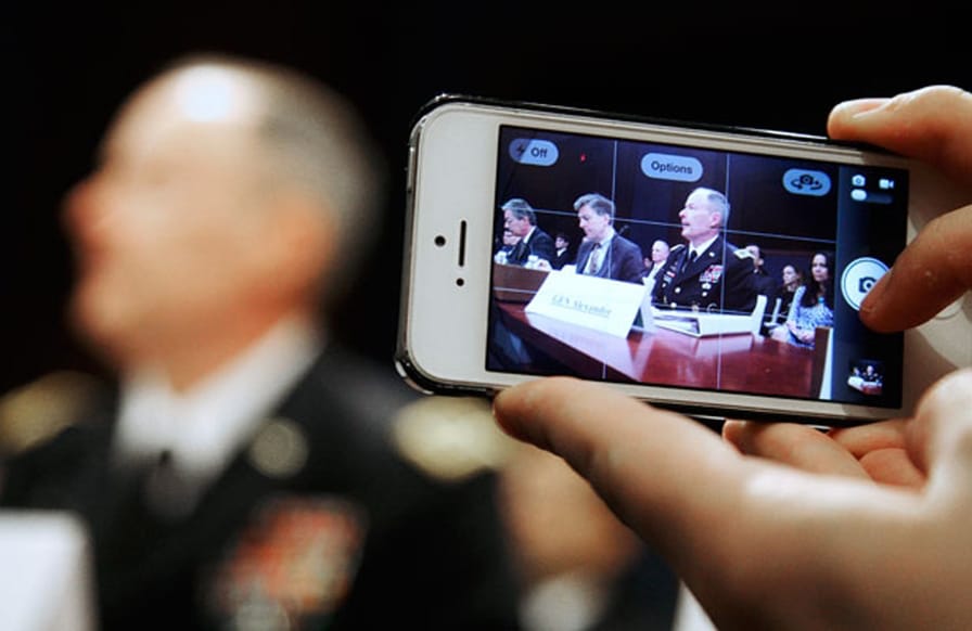 A-reporter-takes-a-mobile-phone-picture-of-National-Security-Agency-NSA-Director-U.S.-Army-General-Keith-Alexander