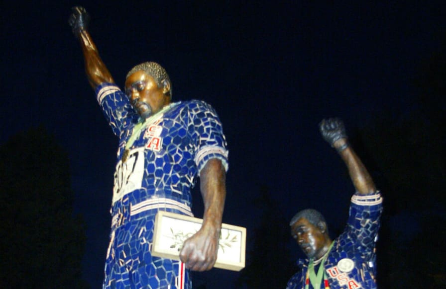 pA-statue-to-former-Olympians-Tommie-Smith-left-and-John-Carlos-rightp