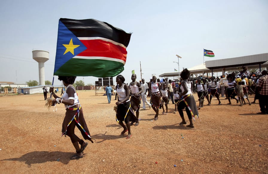 Southern-Sudanese-citizens-hold-their-flag-and-chant-slogans-as-they-march-in-the-streets-in-support-of-the-independence-referendum-in-Juba-South-Sudan-December-9-2010.-ReutersBenedicte-Desrus
