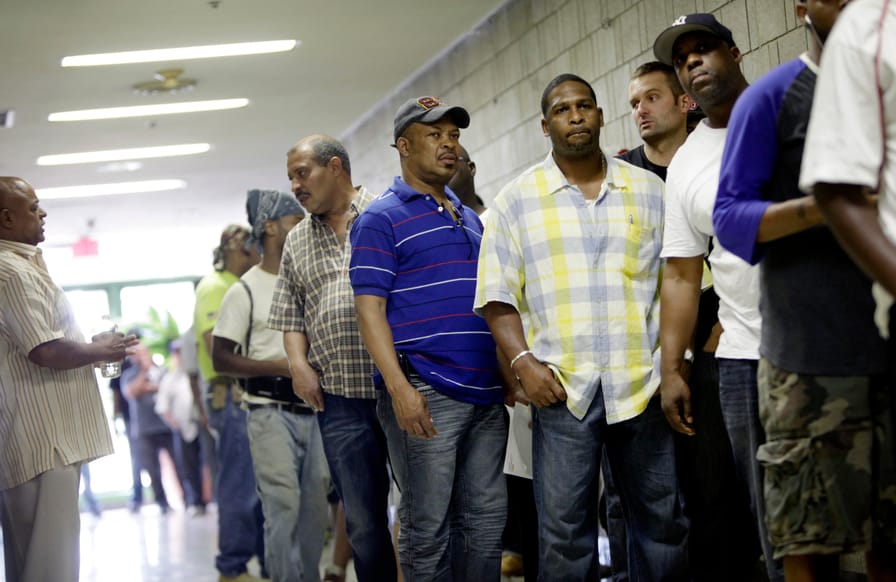 Men-wait-in-line-to-a-apply-for-jobs