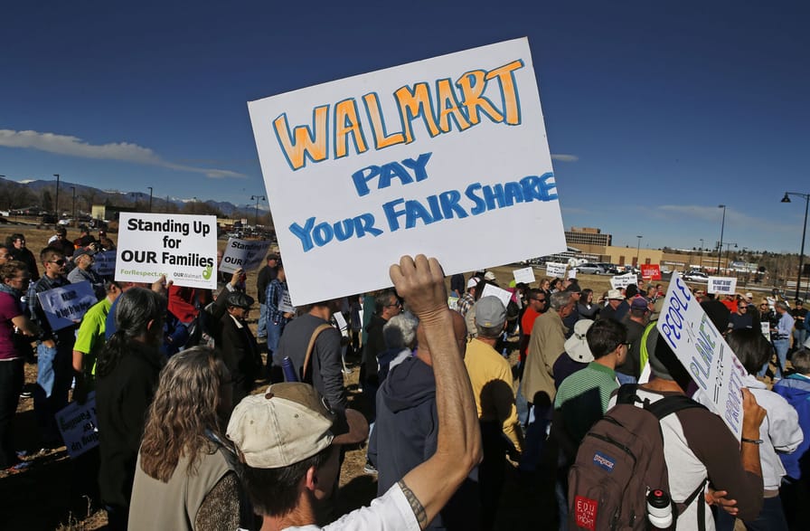 Colorado-Walmart-employees-and-supporters-protest-in-front-of-a-Walmart-store-in-Lakewood-Colo.-Friday-Nov.-29-2013.-AP-PhotoBrennan-Linsley