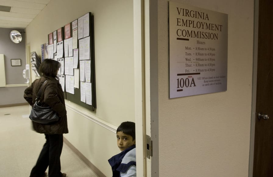 A-woman-looks-at-job-postings-with-her-son-at-the-Virginia-Employment-Commission-office-in-Alexandria-Virginia-on-November-6-2009.-ReutersMolly-Riley