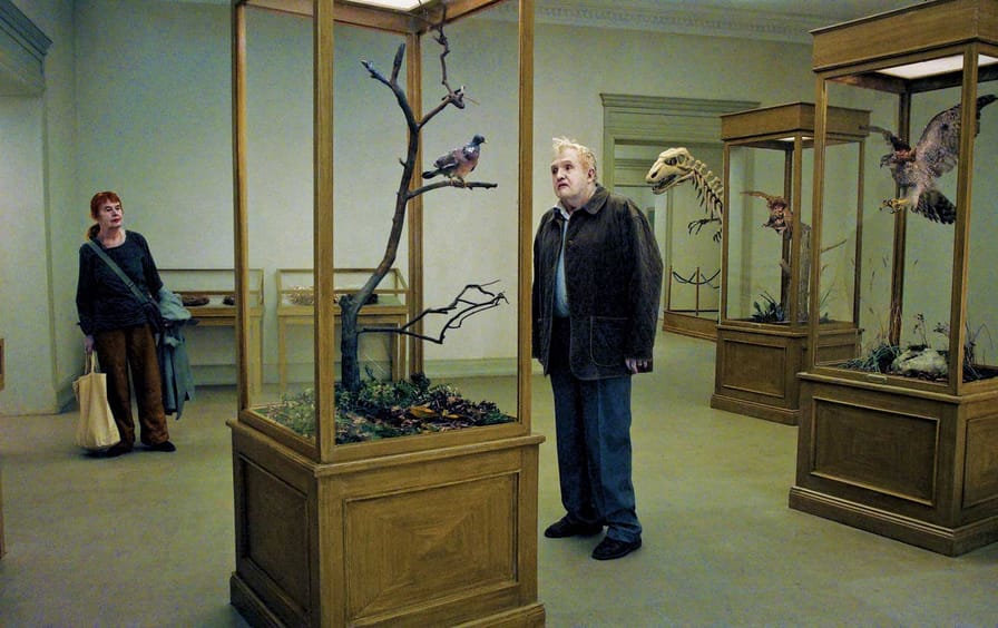 Per-Bergqvist-right-and-Solveig-Andersson-in-A-Pigeon-Sat-on-a-Branch-Reflecting-on-Existence