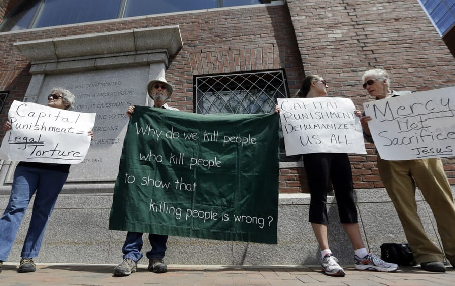Demonstrators protest the death penalty for Dzhokhar Tsarnaev.