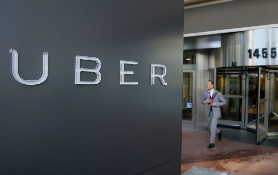 A man leaves the headquarters of Uber in San Francisco.
