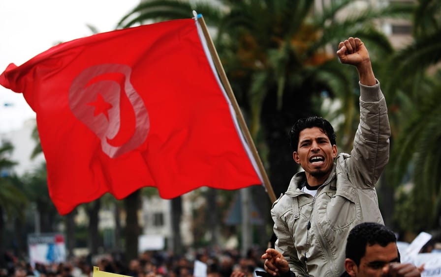 Tunisian protesters rally against the Ben Ali government.