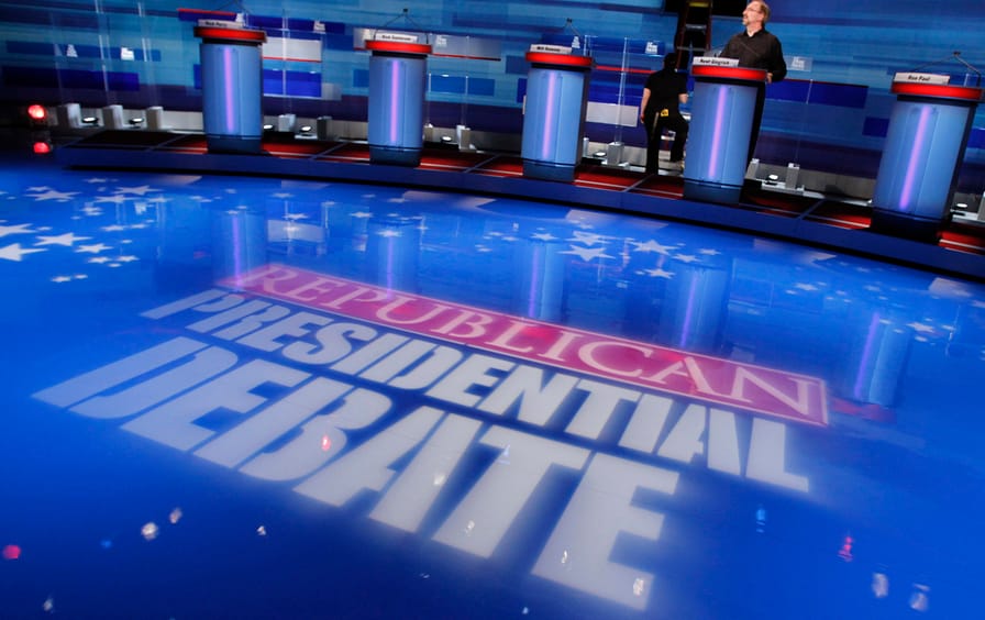 Stage hands prepare for the South Carolina Republican presidential candidates debate in Myrtle Beach