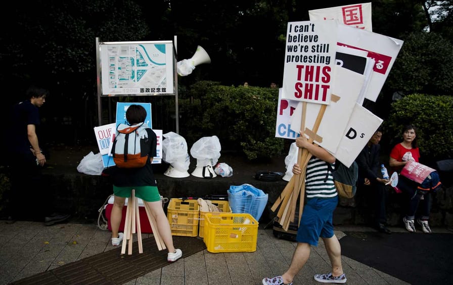 Members of the antiwar group SEALDs (Students Emergency Action for Liberal Democracy) rally outside Japan's parliament building, August 21, 2015.