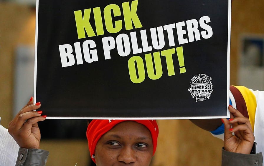 An activist protesting polluters at the Climate Generations Areas at COP21, the United Nations Climate Change Conference, Wednesday, December 2, 2015.