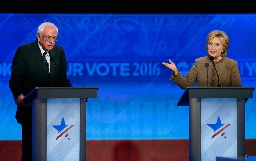 Bernie Sanders and Hillary Clinton during the Democratic presidential primary debate, Saturday, December 19, 2015, at Saint Anselm College in Manchester, New Hampshire.