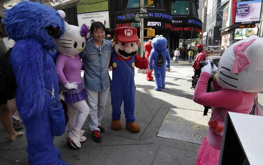Cookie Monster, Hello Kitty, and Super Mario in Times Square.