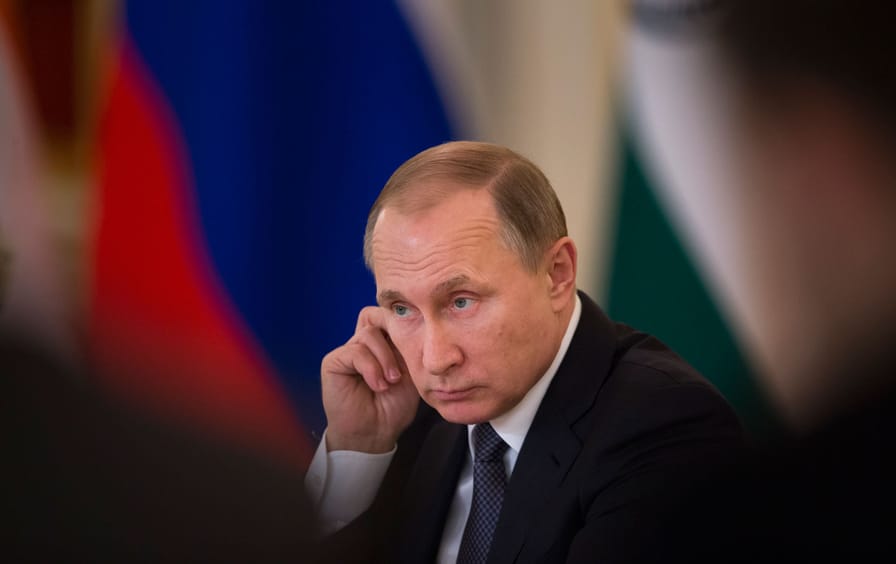 Russian President Vladimir Putin attends a meeting with Russian officials.