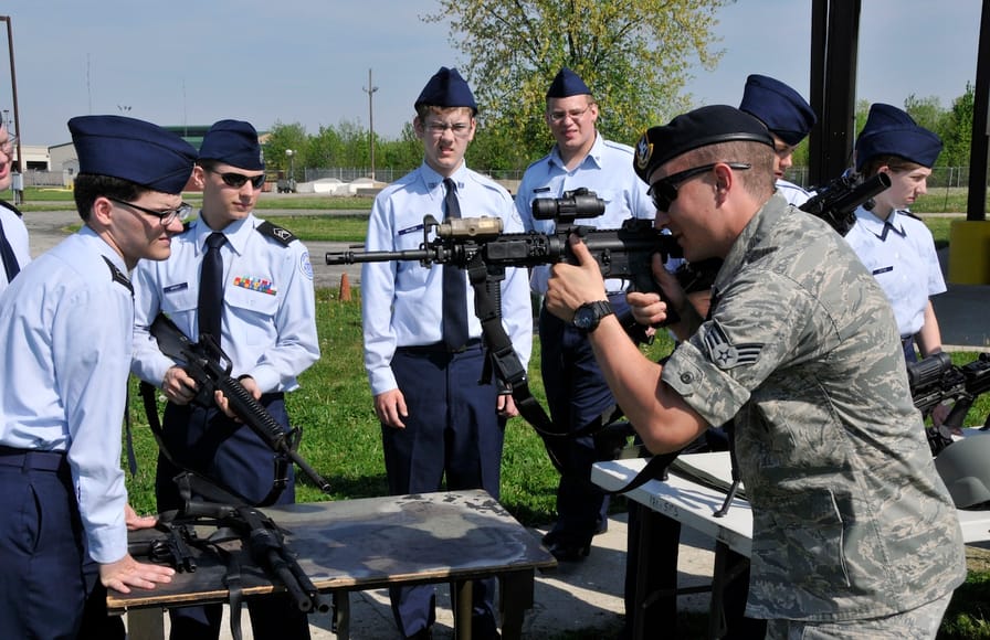A airman in the United States Air Force demonstrates proper firing position