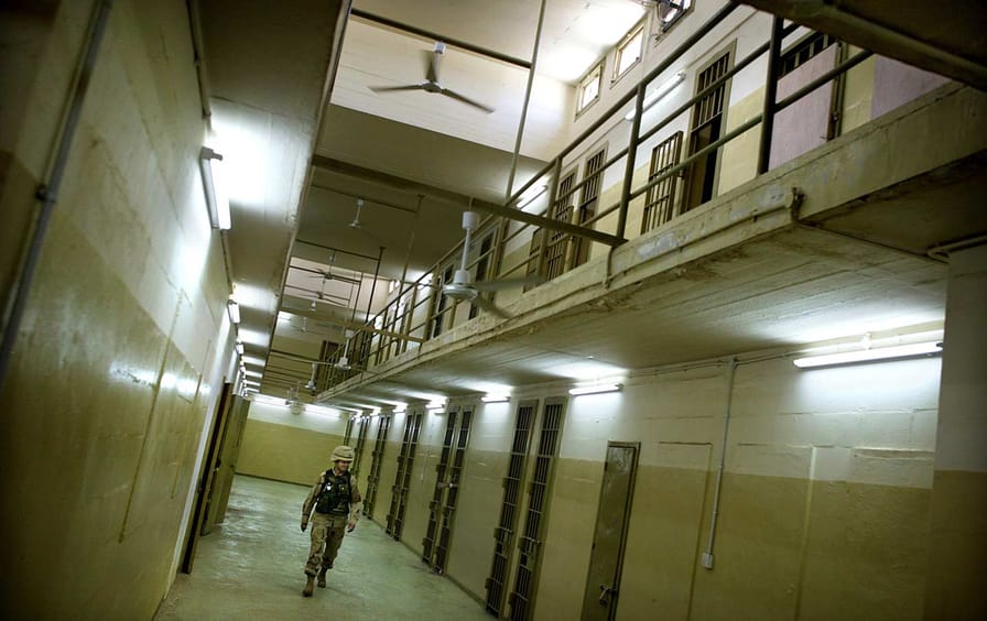 Soldier walks through Abu Ghraib