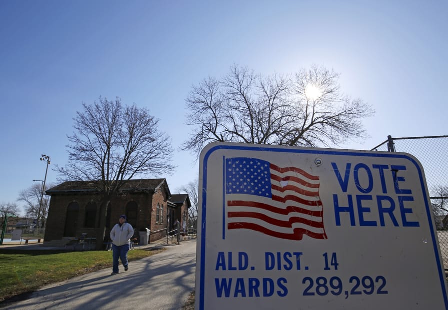 A voter leaves a polling stations after casting their ballot in the Wisconsin presidential primary election in Milwaukee