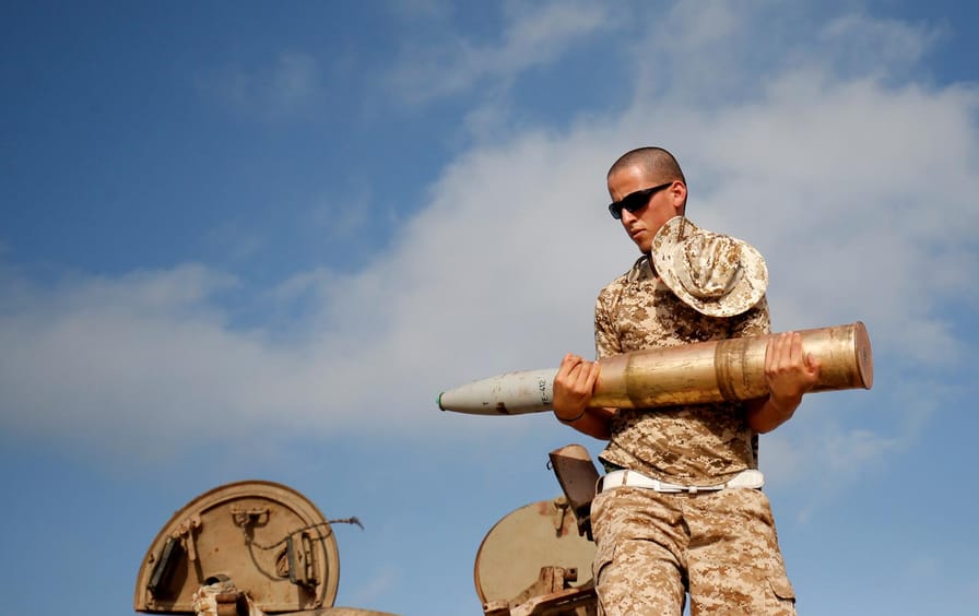 Libyan Soldier Loads Tank