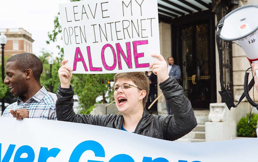 Activists gather outside American Enterprise Institute to protest FCC Chairman Ajit Pai and the Trump administration’s attacks on net neutrality.