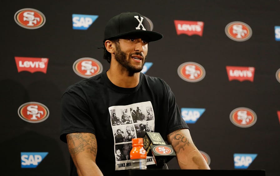 Colin Kaepernick answers questions at a news conference on August 26, 2016.