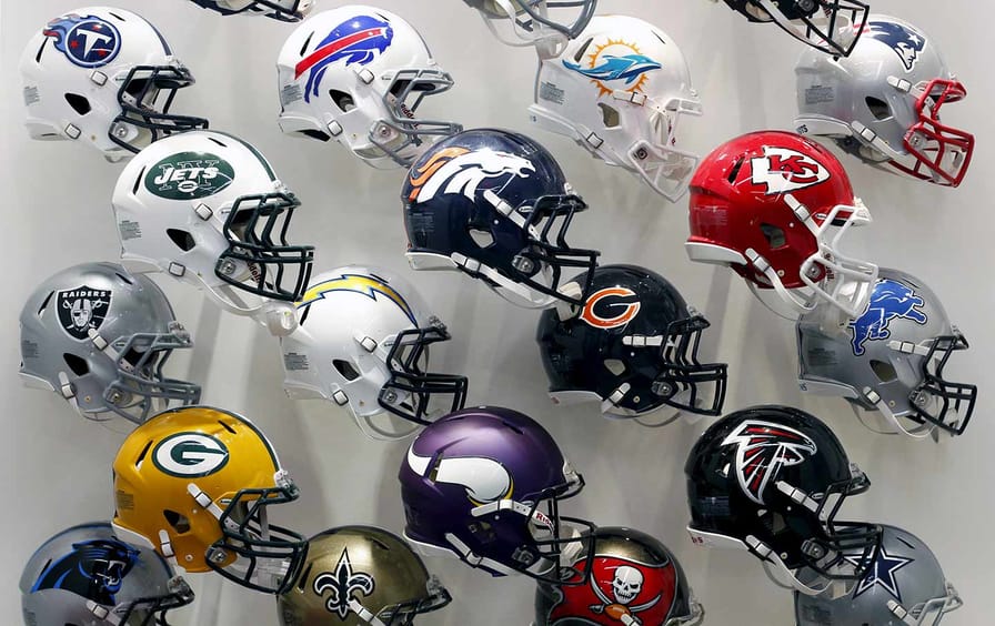 NFL team helmets on display at the NFL Headquarters in New York on December 3, 2015.