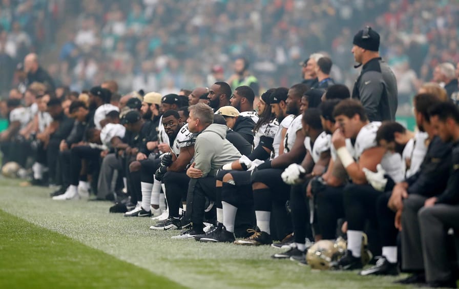 New Orleans Saints players take the knee