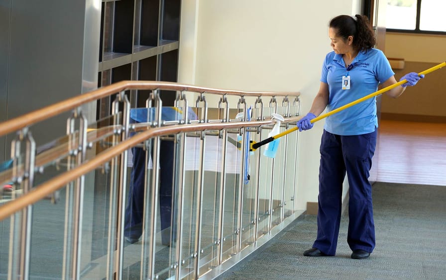 Housekeeper Rosalinda Franco cleans the glass at Littleton Adventist Hospital in Colorado, May 3, 2016