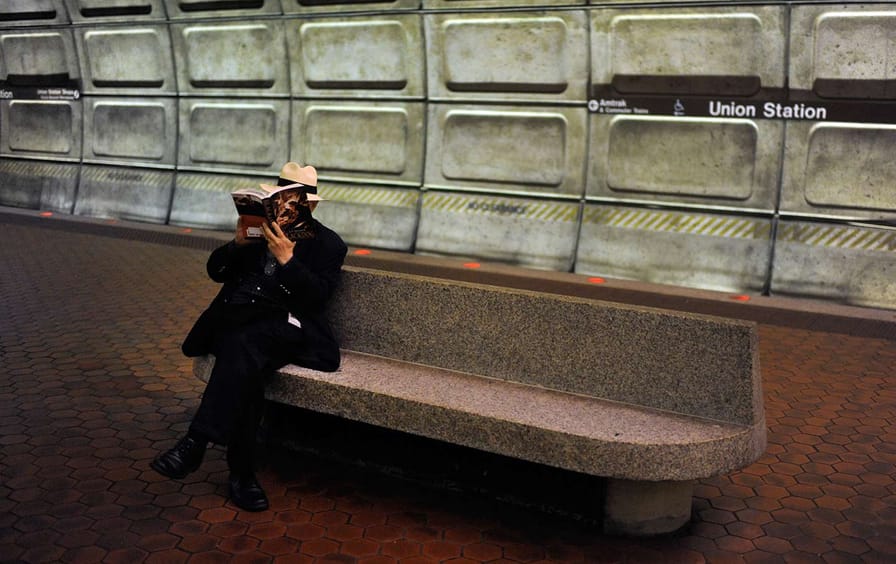 Man Reads in DC Metro