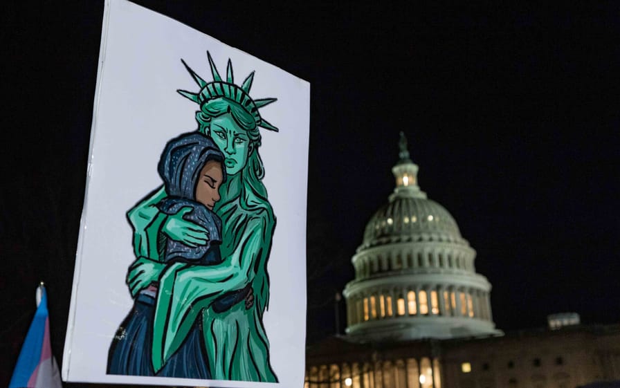 US Capitol vs Statue of Liberty hugging an immigrant