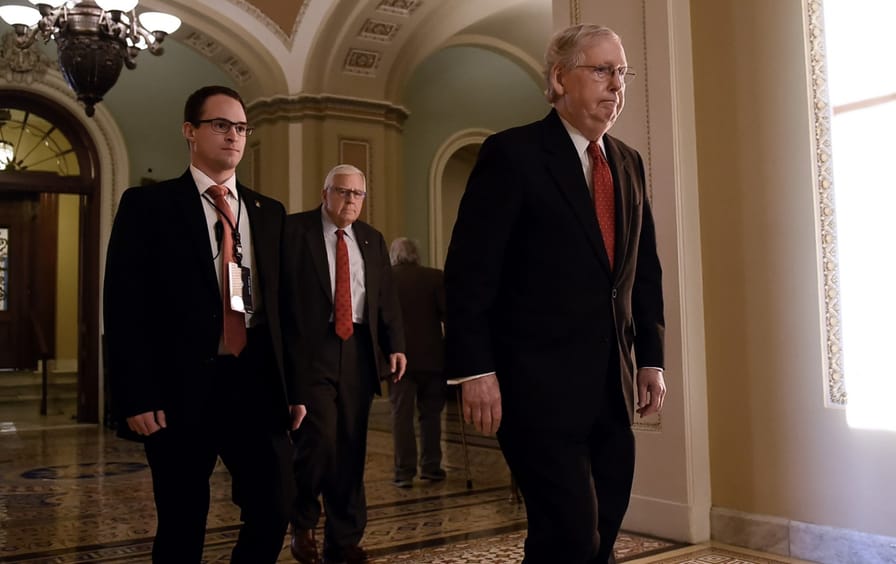 Mitch McConnell leaves the Senate chamber on recess from impeachment trial.