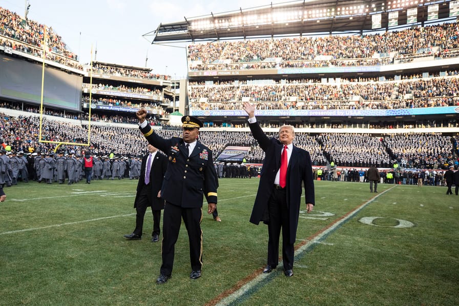 Donald Trump waves to the crowd at the Army-Navy football game