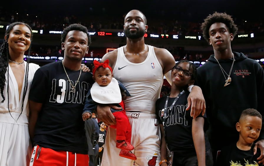 Dwyane Wade poses for a photo with his wife, Gabrielle Union, nephew, Dahveon Morris, and children, Kaavia James Union Wade, Zaire Wade, Xavier Wade and Zaya Wade after his final career home game in April, 2019 in Miami, Florida.