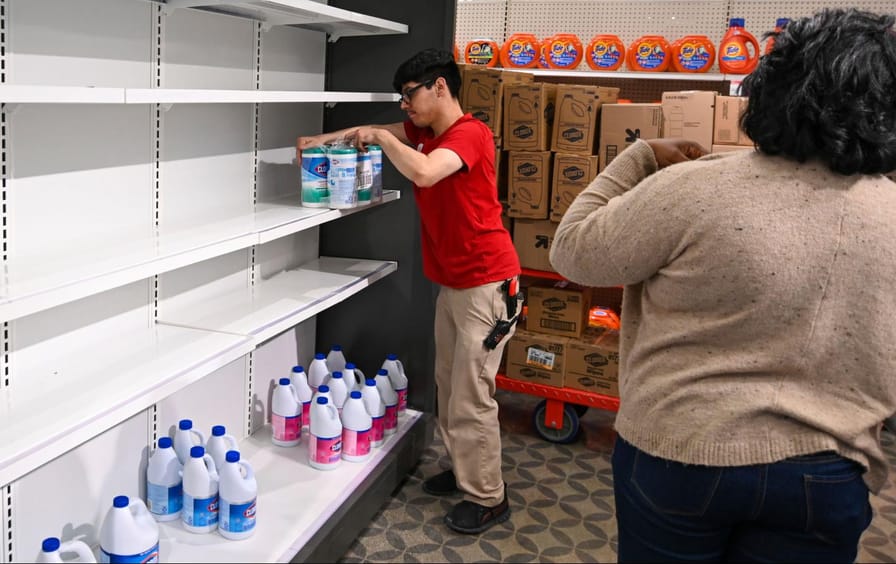 A target worker stocks goods at a store in Riverside, California