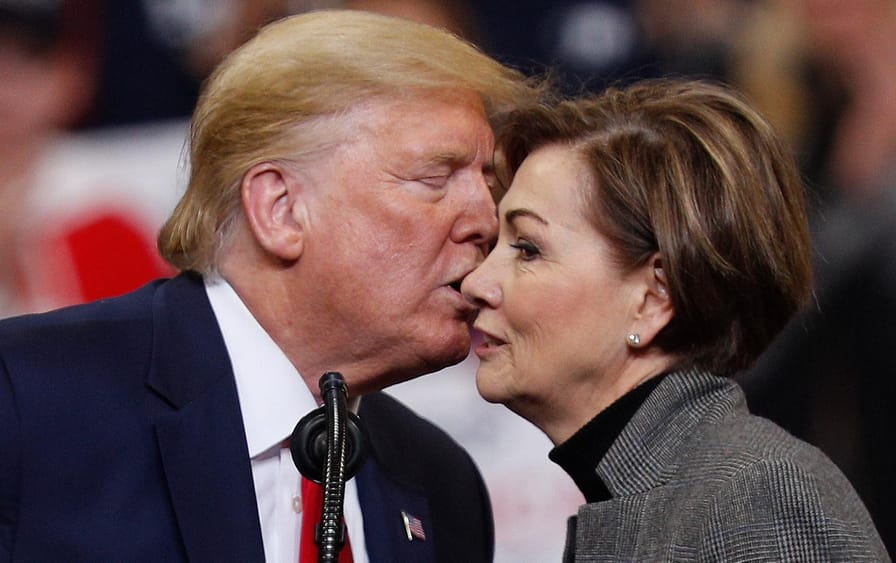 Donald Trump kisses Kim Reynolds on the cheek