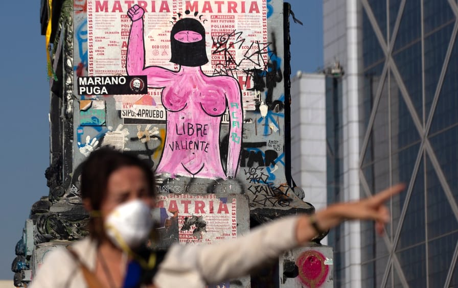 A woman wears a face mask during a protest in Chile