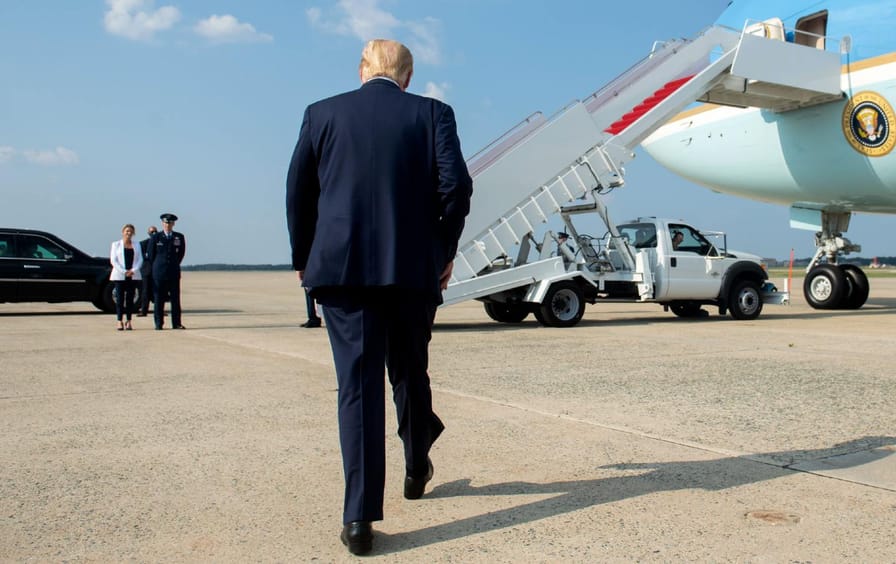 Donald Trump walks toward Air Force One