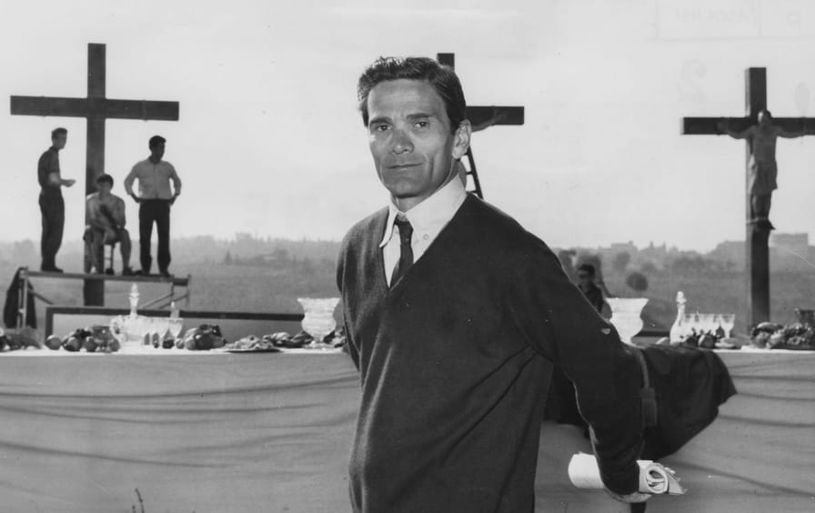 Pier Paolo Pasolini in front of a biblical scene during the filming of La Ricotta, 1962.