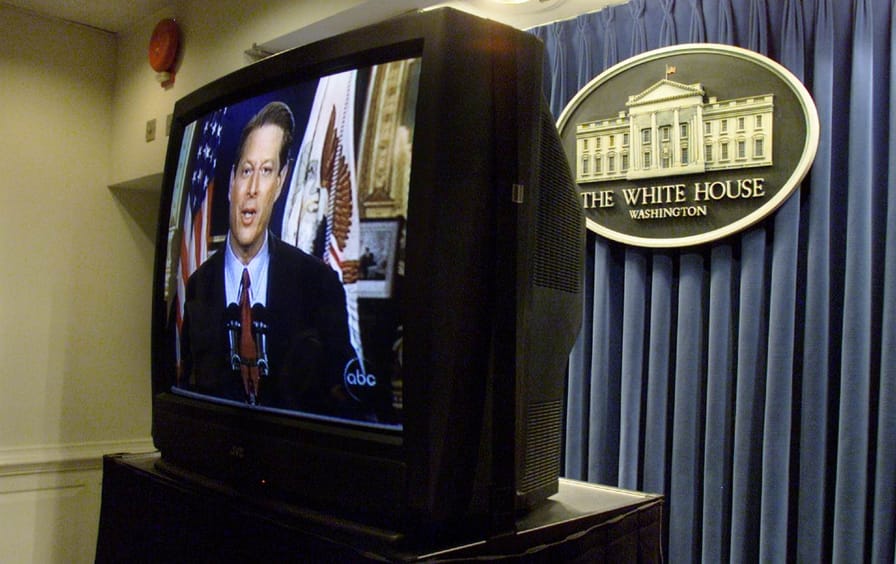 A television at the White House shows Al Gore giving his concession speech