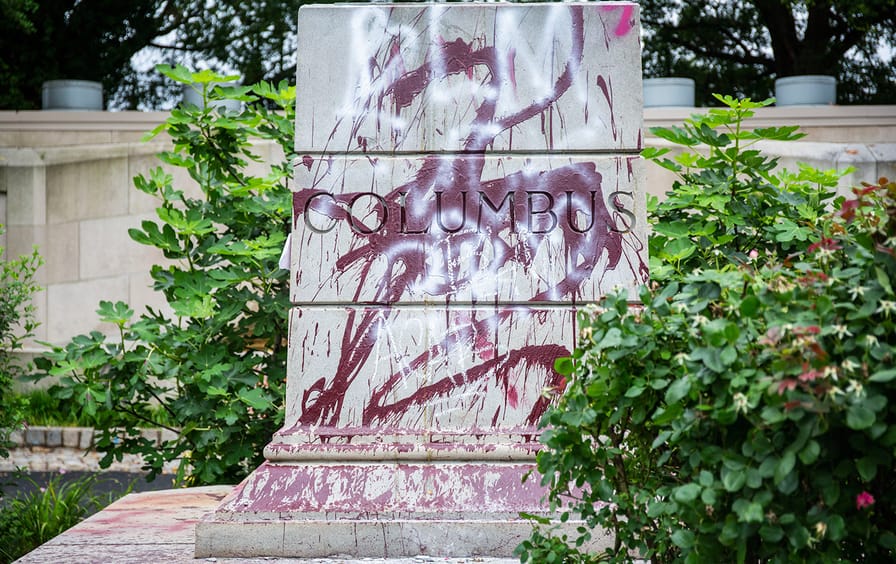 Christopher Columbus pedestal graffiti