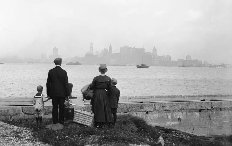 Immigrant Family Looking at New York Skyline